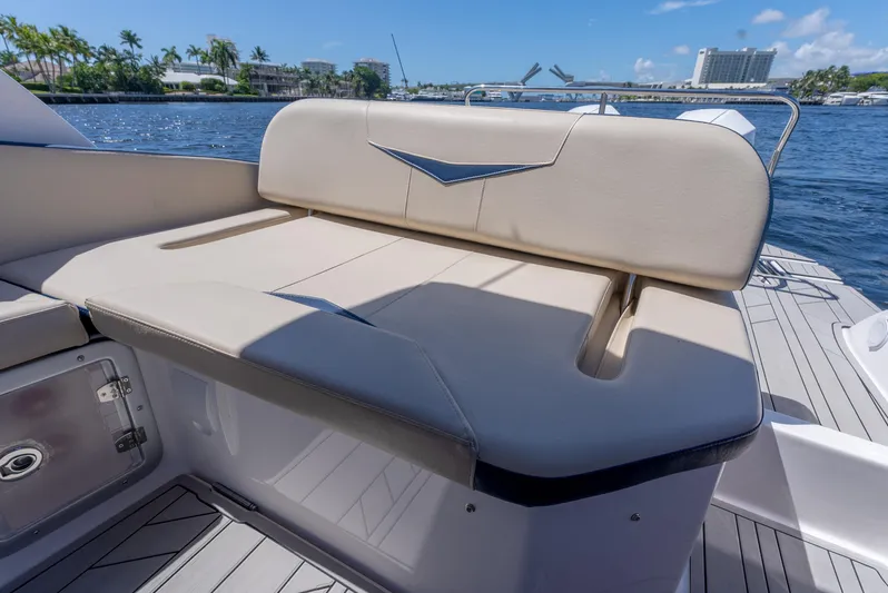  Yacht Photos Pics Luxury seating on 2024 Hanover 305 boat, with scenic waterfront view.