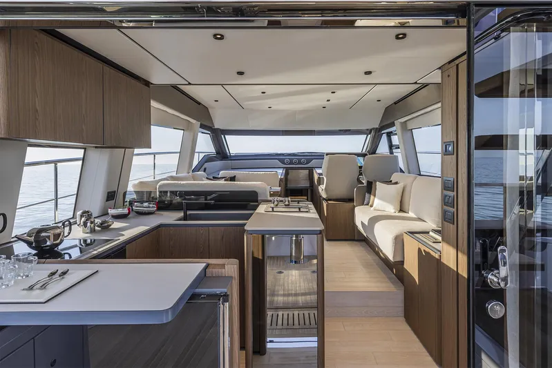  Yacht Photos Pics Luxurious interior of 2025 Ferretti Yachts 580, featuring modern kitchen and seating area.