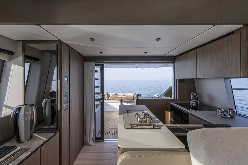  Yacht Photos Pics Luxurious interior of 2025 Ferretti Yachts 580 with modern kitchen and ocean view.
