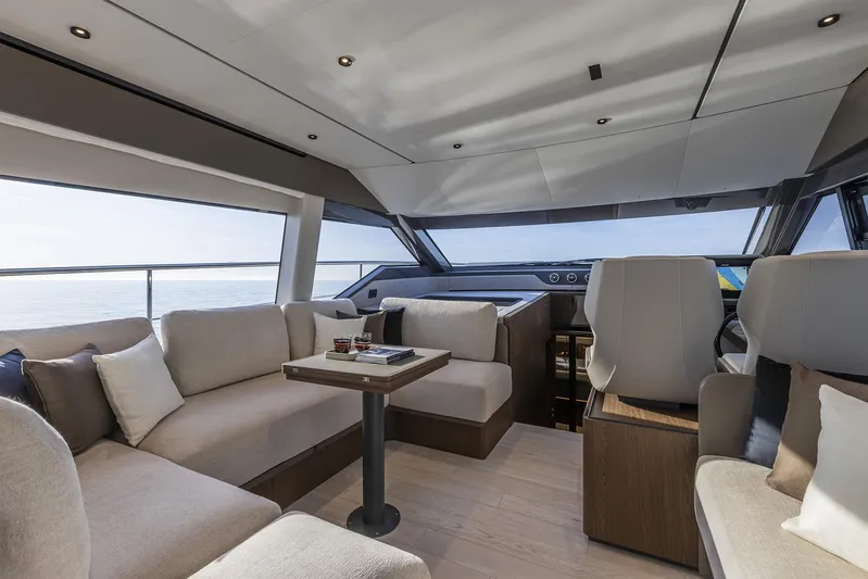  Yacht Photos Pics Luxurious interior of 2025 Ferretti Yachts 580 with modern seating and panoramic windows.