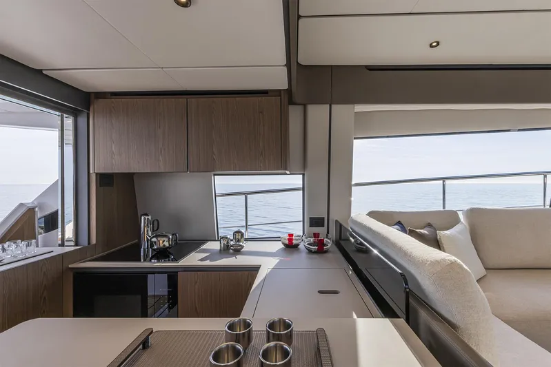  Yacht Photos Pics Luxurious interior of 2025 Ferretti Yachts 580 with modern kitchen and ocean view.