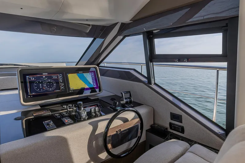  Yacht Photos Pics Modern helm of 2025 Ferretti Yachts 580 with advanced navigation system and ocean view.