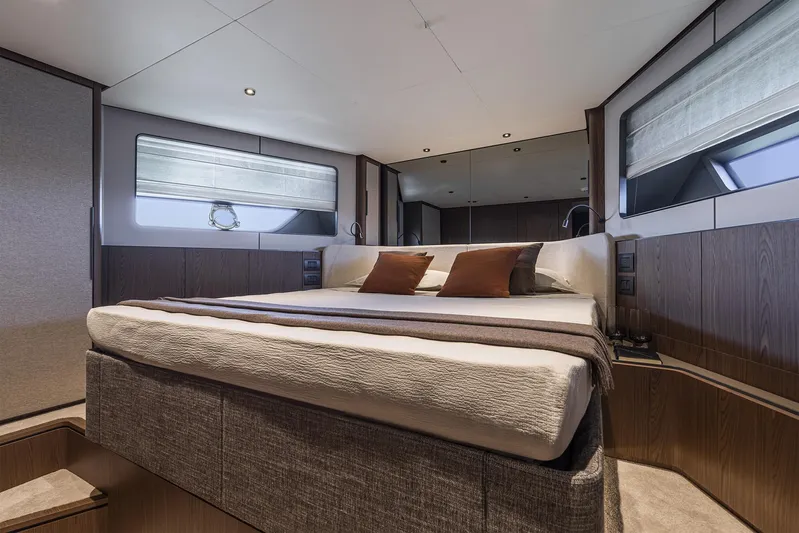  Yacht Photos Pics Luxurious bedroom interior of 2025 Ferretti Yachts 580 with modern design and elegant furnishings.