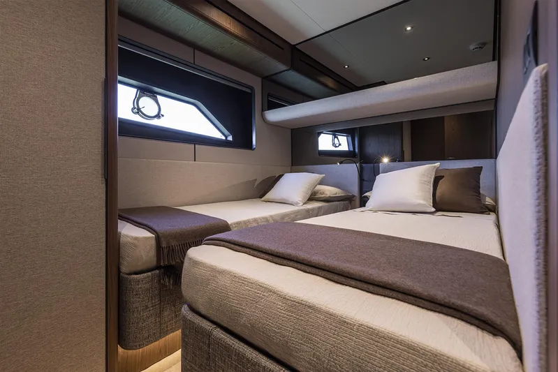  Yacht Photos Pics Luxurious cabin interior of 2025 Ferretti Yachts 580 with twin beds and modern design.