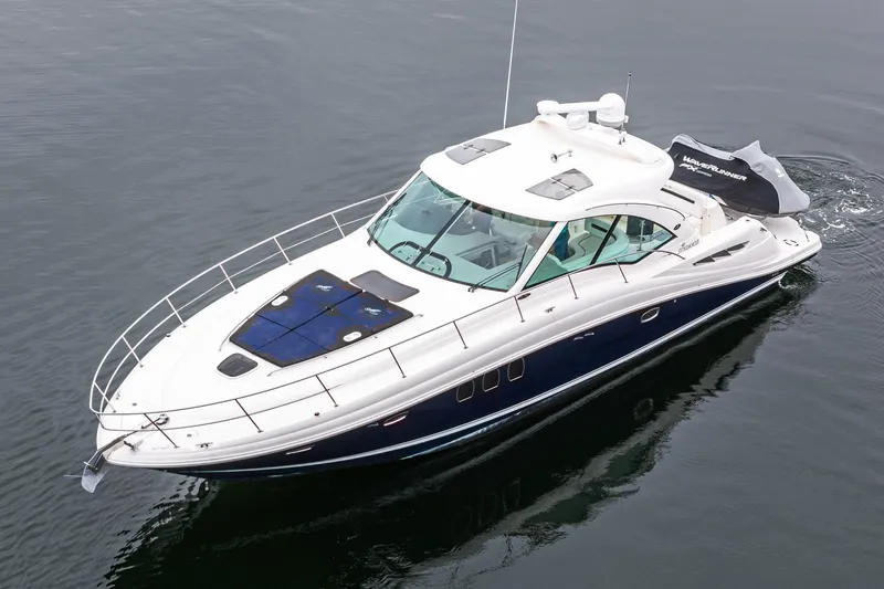  Yacht Photos Pics 2007 Sea Ray 48 Sundancer yacht cruising on calm waters.