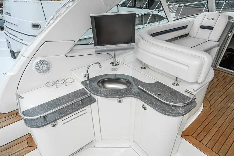  Yacht Photos Pics Luxurious 2007 Sea Ray 48 Sundancer yacht interior with kitchenette and seating area.