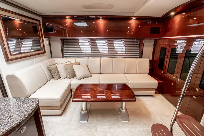 Yacht Photos Pics Luxurious interior of 2007 Sea Ray 48 Sundancer yacht with elegant seating and wooden accents.