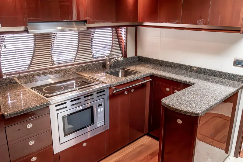  Yacht Photos Pics Luxurious kitchen in 2007 Sea Ray 48 Sundancer yacht with modern appliances and sleek cabinetry.