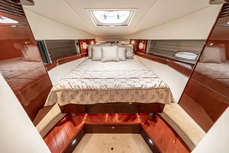  Yacht Photos Pics Luxurious cabin interior of 2007 Sea Ray 48 Sundancer yacht with elegant bedding.