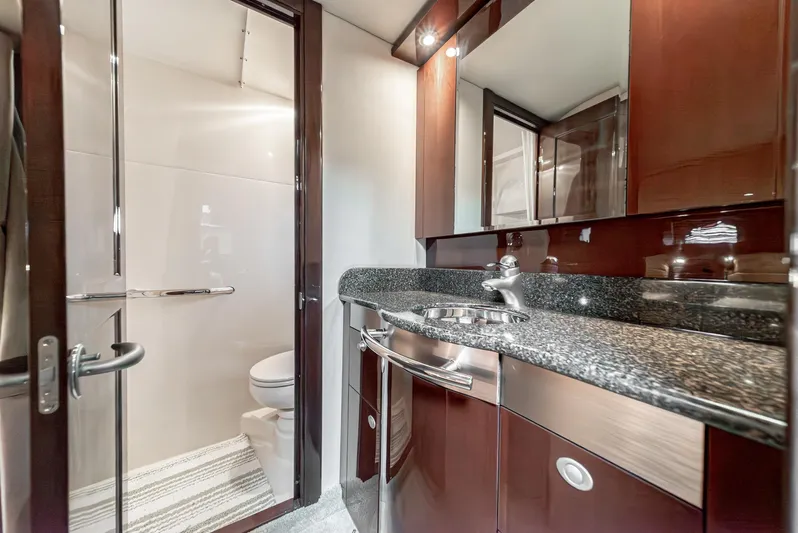  Yacht Photos Pics Luxurious bathroom in 2007 Sea Ray 48 Sundancer yacht with sleek design and modern fixtures.