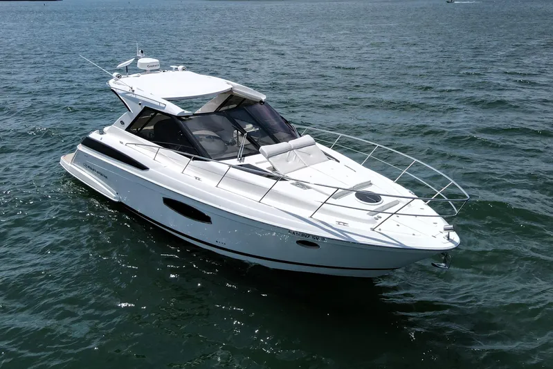 Absolutely Yacht Photos Pics 2017 Regal 42 Sport Coupe yacht cruising on open water.