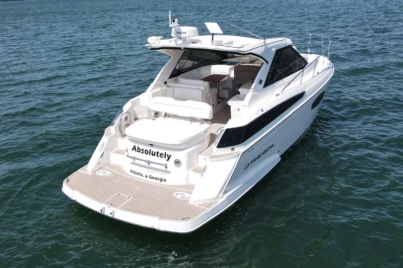 Absolutely Yacht Photos Pics 2017 Regal 42 Sport Coupe yacht on open water, rear view.
