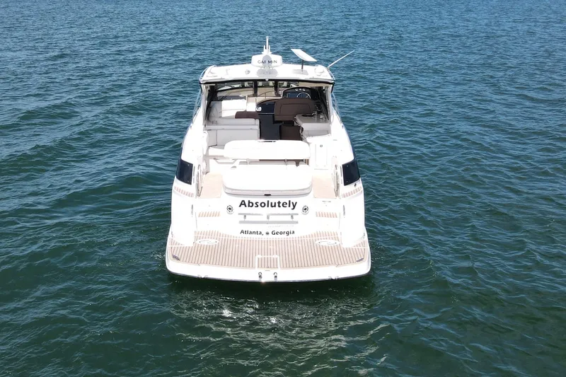 Absolutely Yacht Photos Pics 2017 Regal 42 Sport Coupe yacht on open water, rear view.