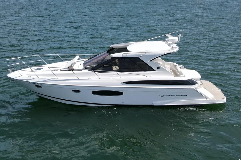 Absolutely Yacht Photos Pics 2017 Regal 42 Sport Coupe yacht cruising on open water.