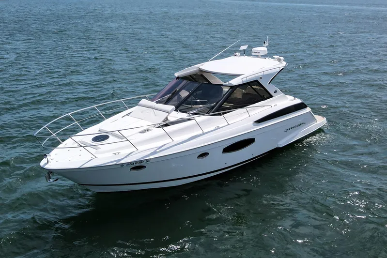 Absolutely Yacht Photos Pics 2017 Regal 42 Sport Coupe yacht cruising on open water.