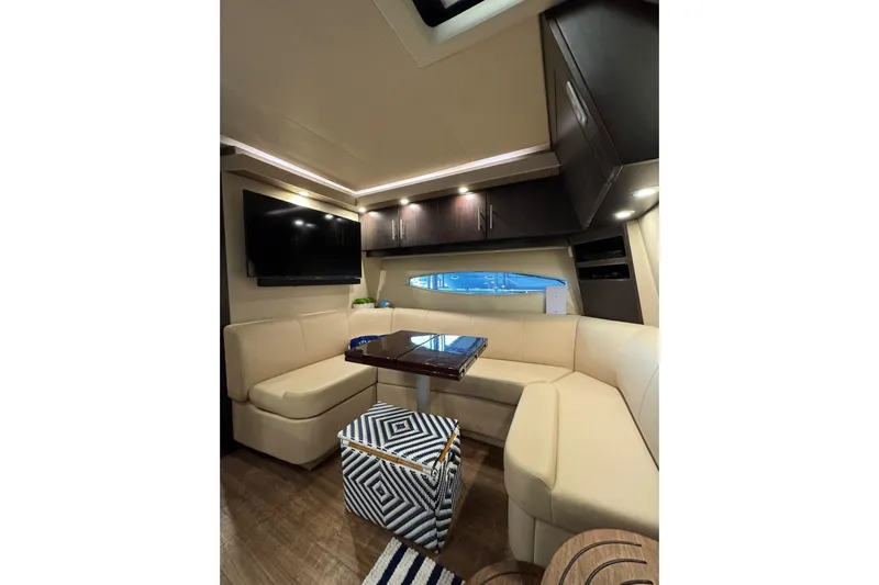 Absolutely Yacht Photos Pics Luxurious interior of 2017 Regal 42 Sport Coupe with plush seating and modern amenities.