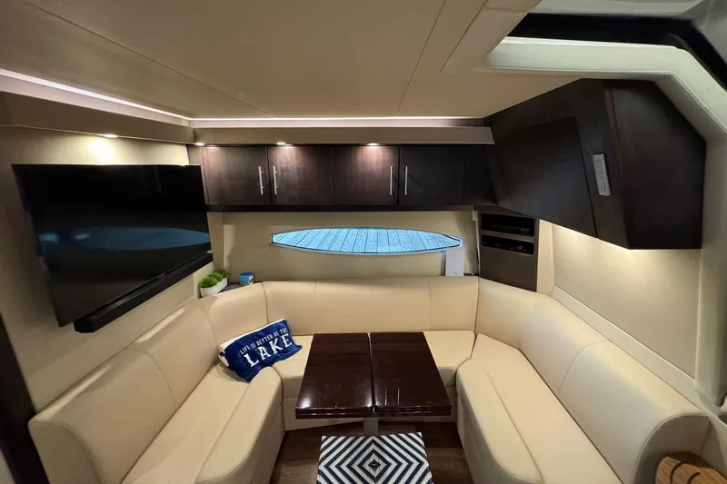 Absolutely Yacht Photos Pics Luxurious interior of 2017 Regal 42 Sport Coupe with cozy seating and modern amenities.