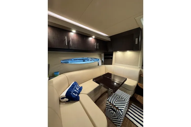 Absolutely Yacht Photos Pics Luxurious interior of 2017 Regal 42 Sport Coupe with elegant seating and modern cabinetry.