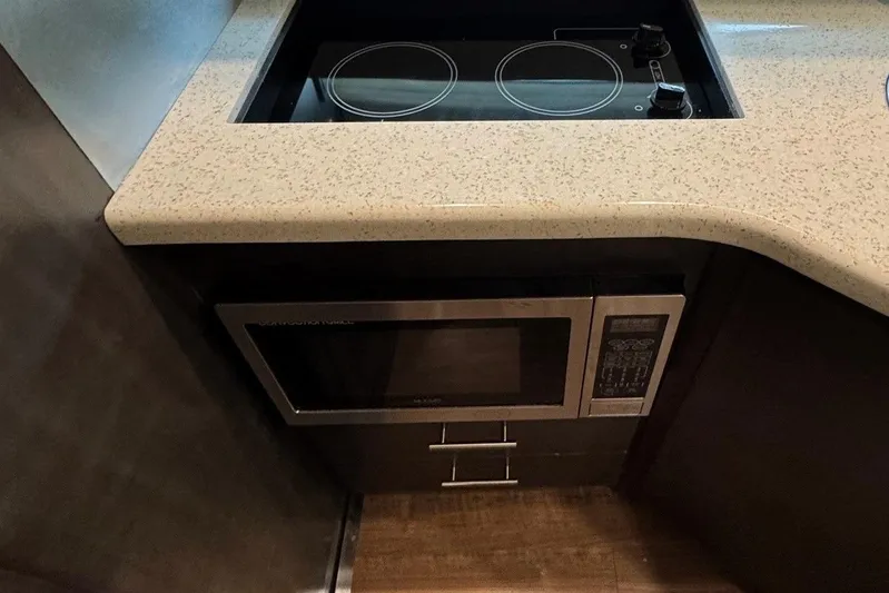 Absolutely Yacht Photos Pics 2017 Regal 42 Sport Coupe kitchen with stovetop and microwave.