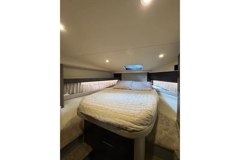 Absolutely Yacht Photos Pics Luxurious bedroom interior of 2017 Regal 42 Sport Coupe yacht with cozy bedding.