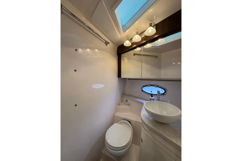 Absolutely Yacht Photos Pics Luxurious bathroom in 2017 Regal 42 Sport Coupe yacht with modern fixtures and skylight.