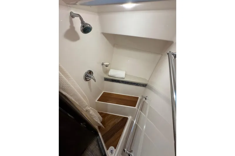 Absolutely Yacht Photos Pics 2017 Regal 42 Sport Coupe shower with wooden accents and modern fixtures.