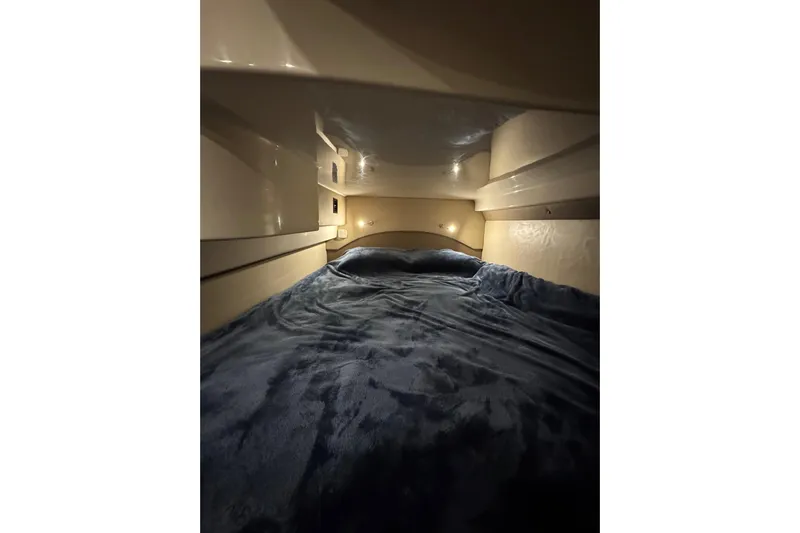 Absolutely Yacht Photos Pics Cozy cabin interior of 2017 Regal 42 Sport Coupe with plush bedding.
