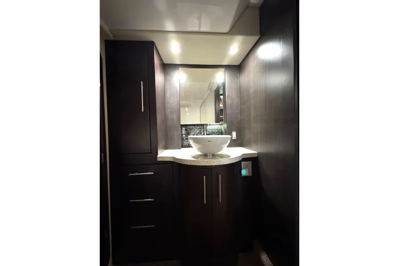 Absolutely Yacht Photos Pics Luxurious bathroom interior of 2017 Regal 42 Sport Coupe yacht with modern fixtures.