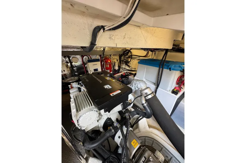 Absolutely Yacht Photos Pics Engine room of 2017 Regal 42 Sport Coupe with visible components and wiring.