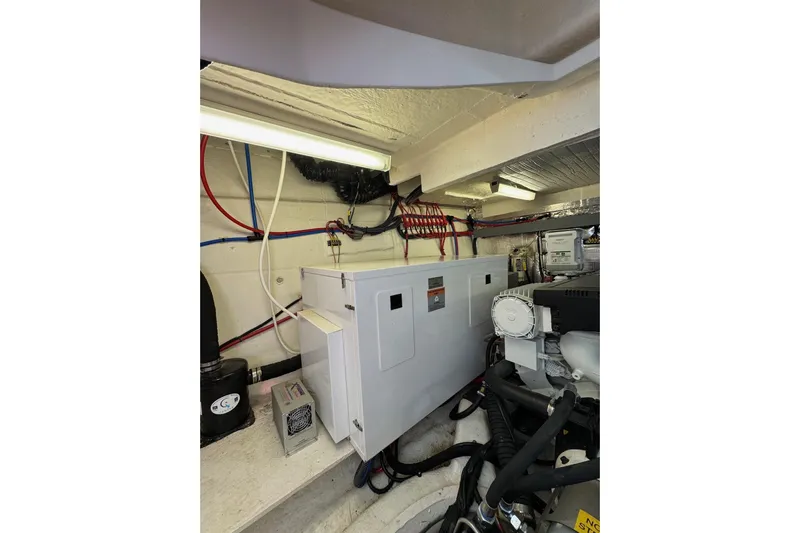 Absolutely Yacht Photos Pics Engine room of 2017 Regal 42 Sport Coupe with electrical components and wiring.