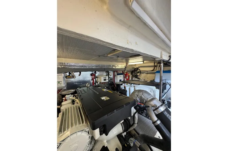 Absolutely Yacht Photos Pics Engine room of 2017 Regal 42 Sport Coupe, showcasing mechanical components and equipment.