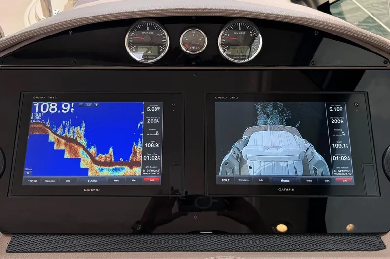 Absolutely Yacht Photos Pics Dashboard of a 2017 Regal 42 Sport Coupe with Garmin navigation displays.