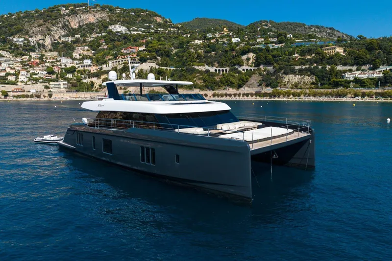 Manta Yacht Photos Pics Luxury 2022 Sunreef 80 Power MANTA yacht cruising near scenic coastline.