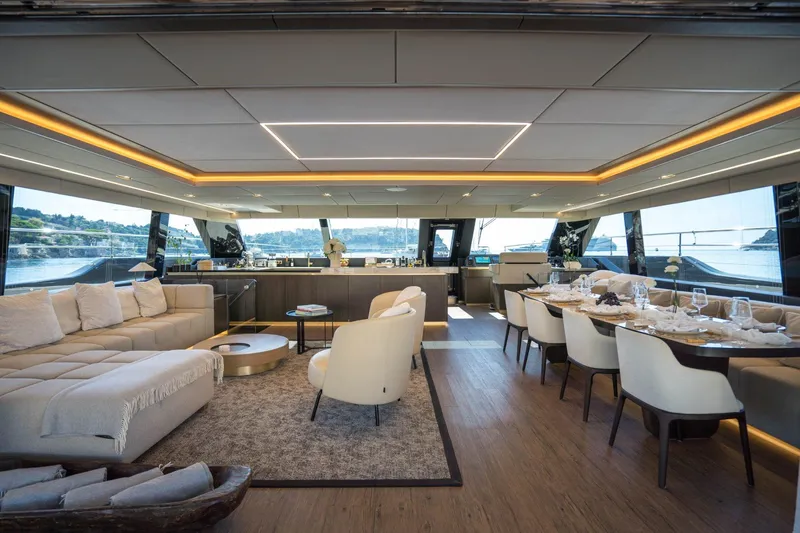 Manta Yacht Photos Pics Luxurious interior of 2022 Sunreef 80 Sunreef Power MANTA yacht with elegant dining and seating areas.