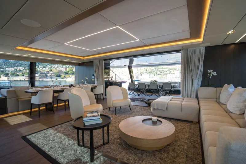 Manta Yacht Photos Pics Luxurious interior of 2022 Sunreef 80 Sunreef Power MANTA yacht, featuring elegant seating and dining area.