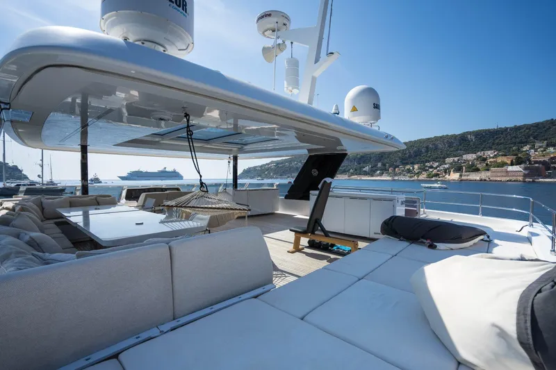 Manta Yacht Photos Pics Luxurious Sunreef 80 Power MANTA yacht deck with seating, hammock, and ocean view, 2022 model.