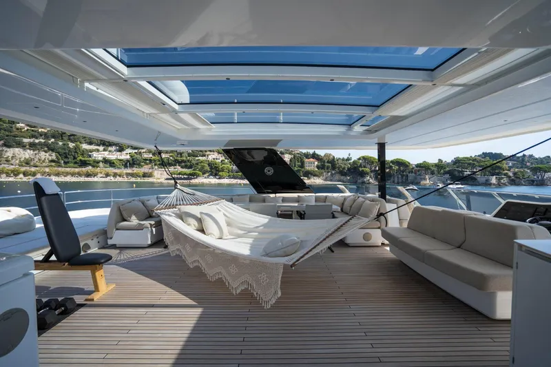 Manta Yacht Photos Pics Luxurious 2022 Sunreef 80 Power MANTA yacht deck with hammock and seating area.