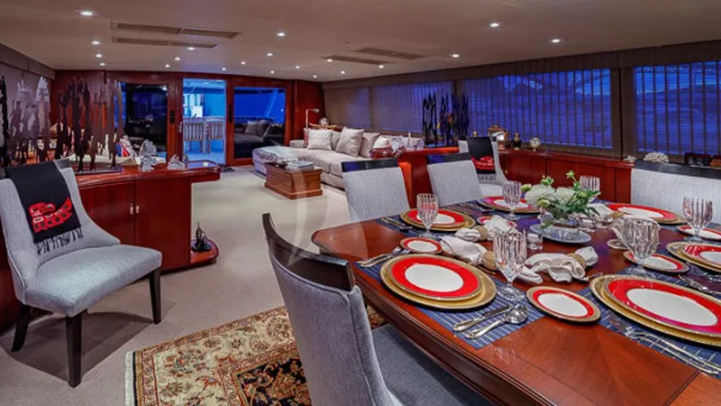 Blackwood Yacht Photos Pics Luxurious dining area on 1998 Broward 103 yacht with elegant table setting.