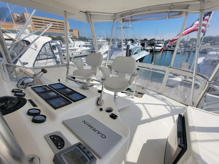  Yacht Photos Pics Helm station of 2001 Ocean Yachts 56 Super Sport with Garmin navigation system.