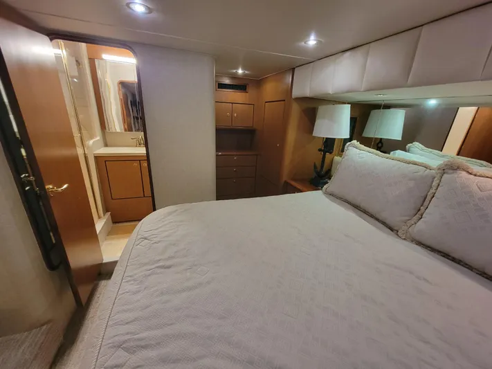  Yacht Photos Pics Luxurious bedroom in 2001 Ocean Yachts 56 Super Sport with ensuite bathroom.