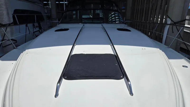 One More Time Yacht Photos Pics 2004 Sea Ray 380 Sundancer boat deck with railings in a marina.