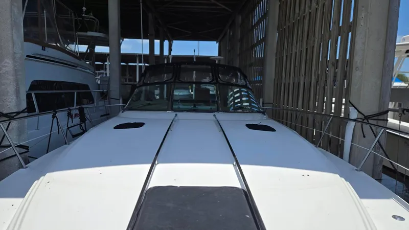 One More Time Yacht Photos Pics 2004 Sea Ray 380 Sundancer docked in a covered marina.