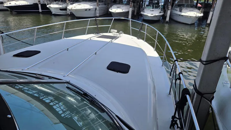 One More Time Yacht Photos Pics 2004 Sea Ray 380 Sundancer yacht docked at marina, view from bow.