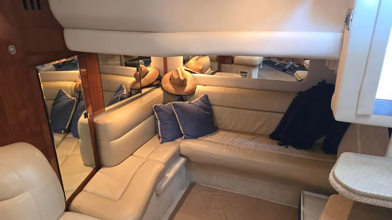 One More Time Yacht Photos Pics Interior of 2004 Sea Ray 380 Sundancer with beige seating and blue cushions.