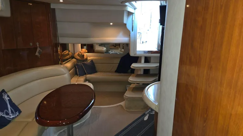 One More Time Yacht Photos Pics Interior of 2004 Sea Ray 380 Sundancer yacht with elegant seating and wooden finishes.