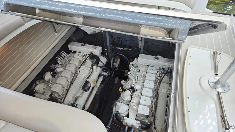 One More Time Yacht Photos Pics 2004 Sea Ray 380 Sundancer engine compartment with dual engines visible.
