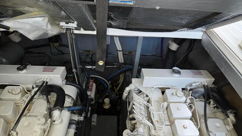One More Time Yacht Photos Pics Engine compartment of 2004 Sea Ray 380 Sundancer with dual engines visible.