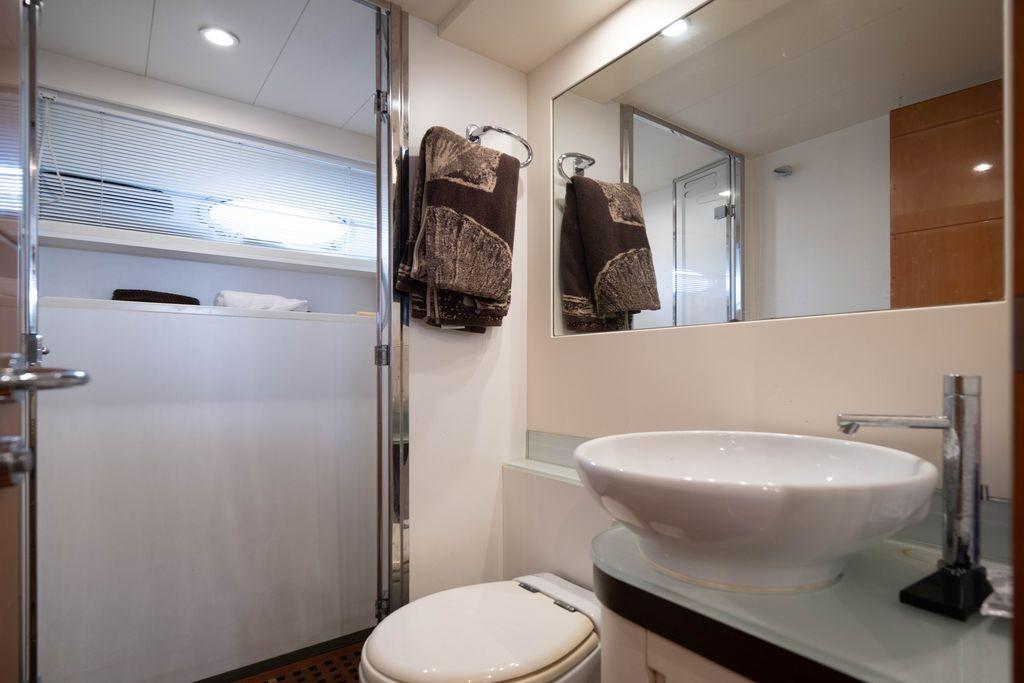 Luxurious bathroom interior of 2007 Pershing 62' yacht with modern fixtures.