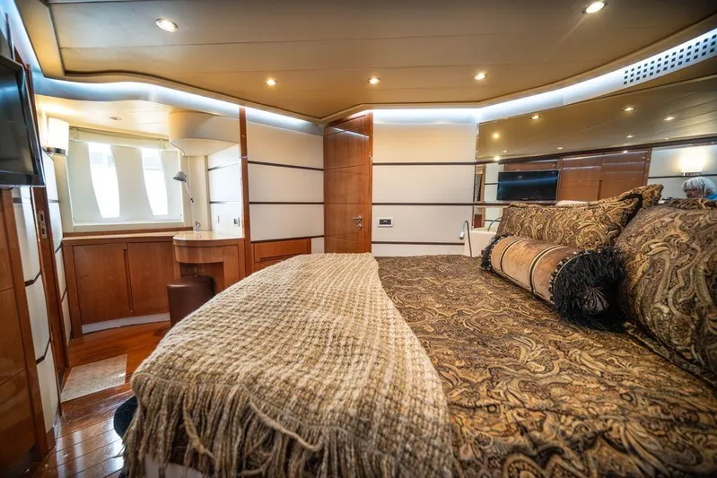 Chopin Yacht Photos Pics Luxurious interior of 2007 Pershing 62' yacht with elegant bedding and wooden accents.