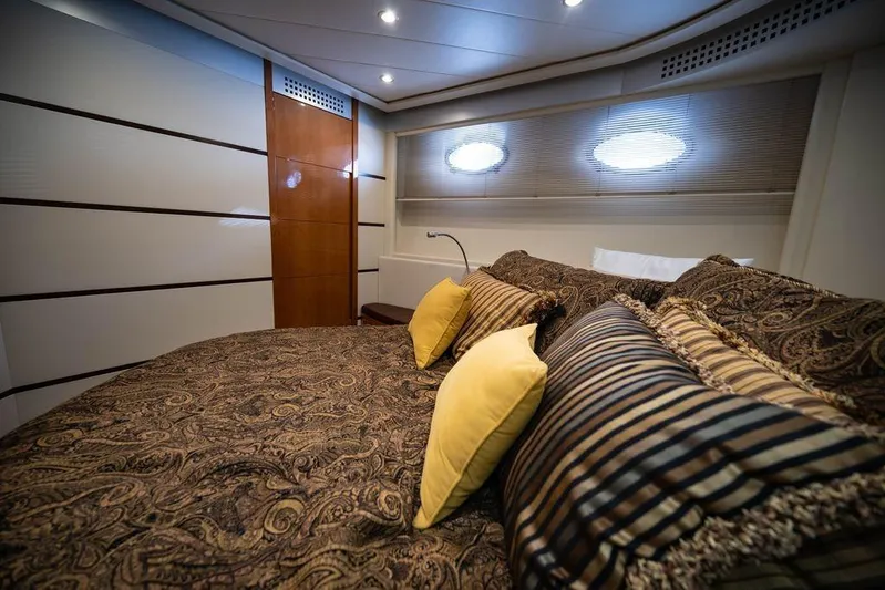 Chopin Yacht Photos Pics Luxurious bedroom interior of 2007 Pershing 62' yacht with elegant bedding and modern design.